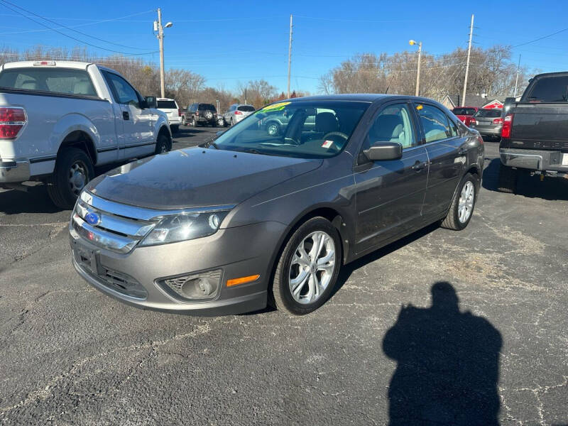 2012 Ford Fusion for sale at VILLAGE AUTO MART LLC in Portage IN