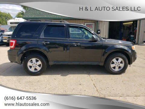 2011 Ford Escape for sale at H & L AUTO SALES LLC in Wyoming MI