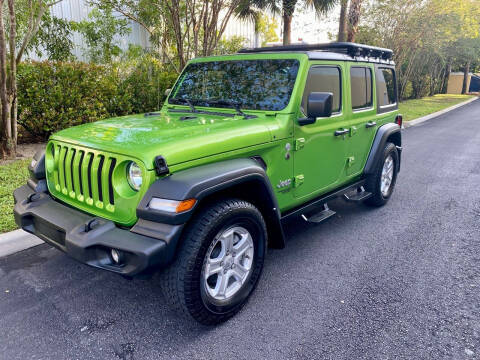 2019 Jeep Wrangler Unlimited for sale at DENMARK AUTO BROKERS in Riviera Beach FL