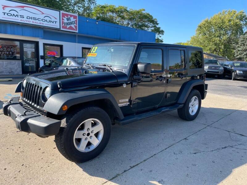 2013 Jeep Wrangler Unlimited for sale at Tom's Discount Auto Sales in Flint MI