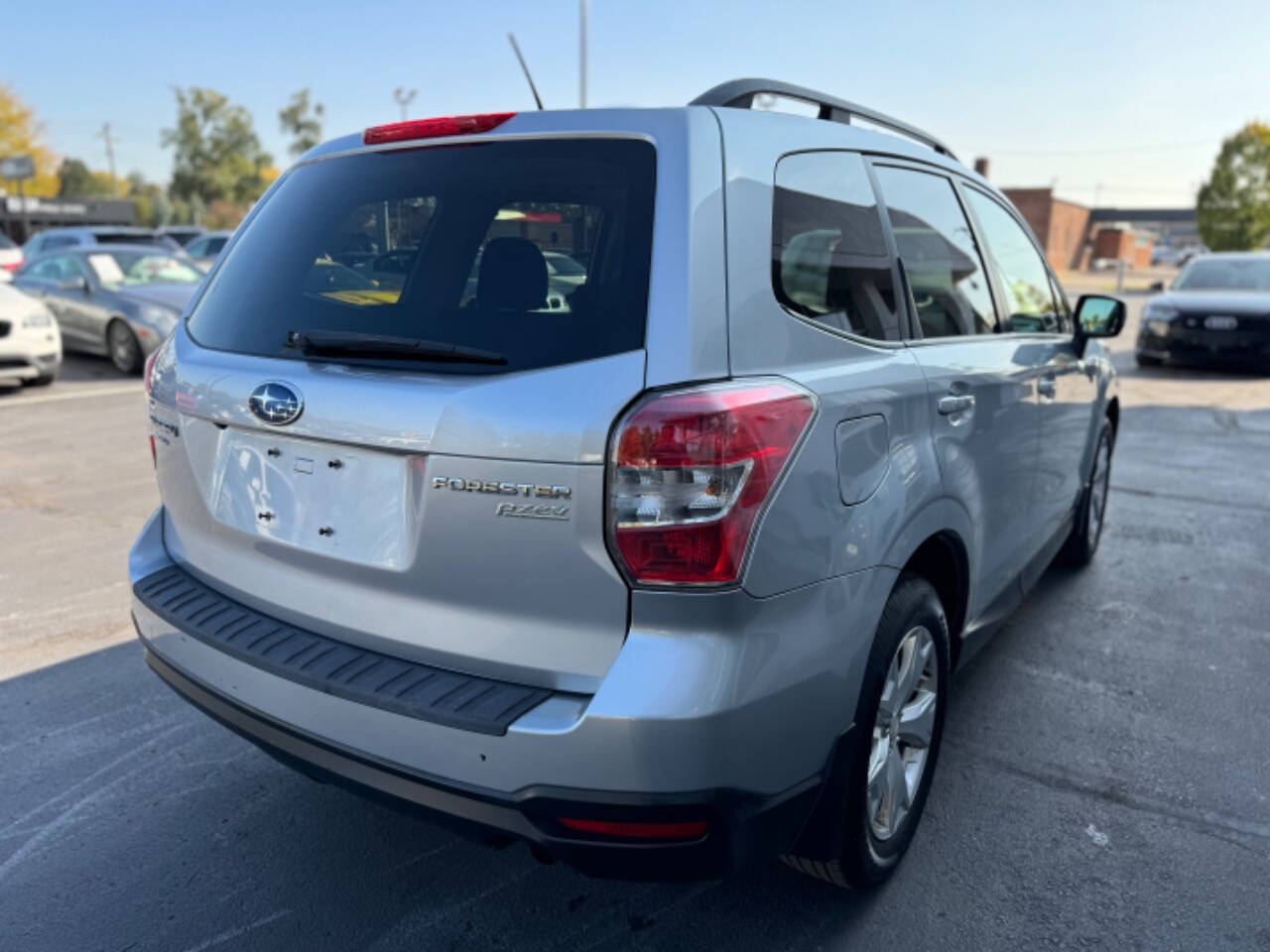 2015 Subaru Forester for sale at Opus Motorcars in Utica, MI