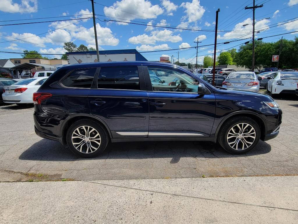 2016 Mitsubishi Outlander for sale at DAGO'S AUTO SALES LLC in Dalton, GA