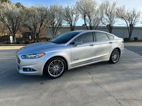 2013 Ford Fusion Hybrid for sale at Triple A's Motors in Greensboro NC