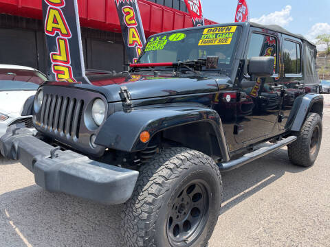 2014 Jeep Wrangler Unlimited for sale at Duke City Auto LLC in Gallup NM