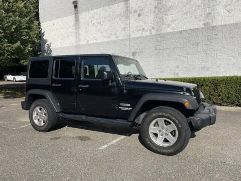 2016 Jeep Wrangler Unlimited for sale at Select Auto in Smithtown NY