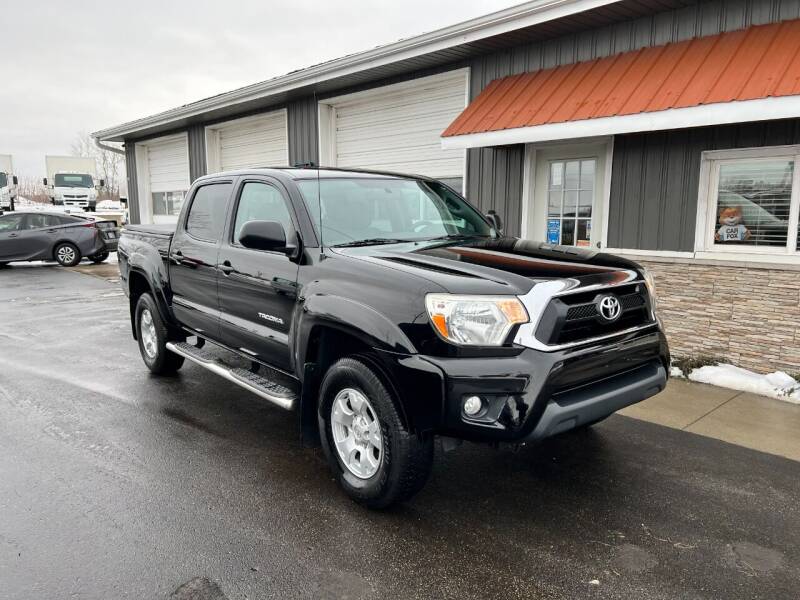 2015 Toyota Tacoma for sale at PARKWAY AUTO in Hudsonville MI