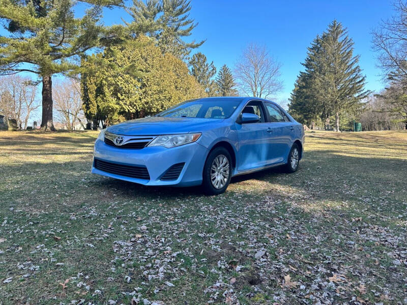 2012 Toyota Camry for sale at Rombaugh's Auto Sales in Battle Creek MI