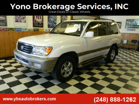 2002 Toyota Land Cruiser for sale at Farmington's Finest Used Autos - Yono Brokerage Services, INC in Farmington MI