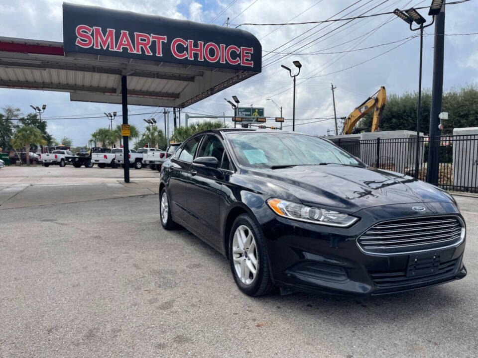 2014 Ford Fusion for sale at SMART CHOICE AUTO in Pasadena, TX