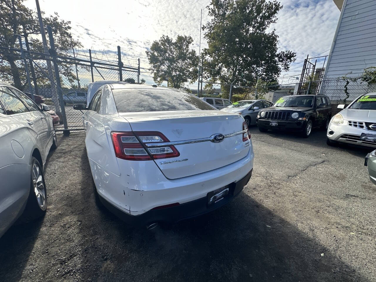 2014 Ford Taurus for sale at 77 Auto Mall in Newark, NJ