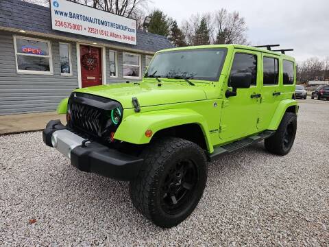 2013 Jeep Wrangler Unlimited for sale at BARTON AUTOMOTIVE GROUP LLC in Alliance OH