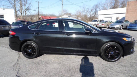 2014 Ford Fusion for sale at G AND J MOTORS in Elkin NC