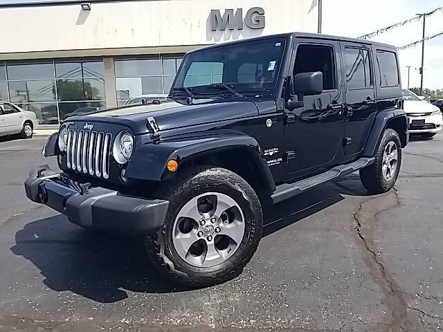 Used 2017 Jeep Wrangler Unlimited Sahara with VIN 1C4BJWEG5HL696413 for sale in Bellefontaine, OH