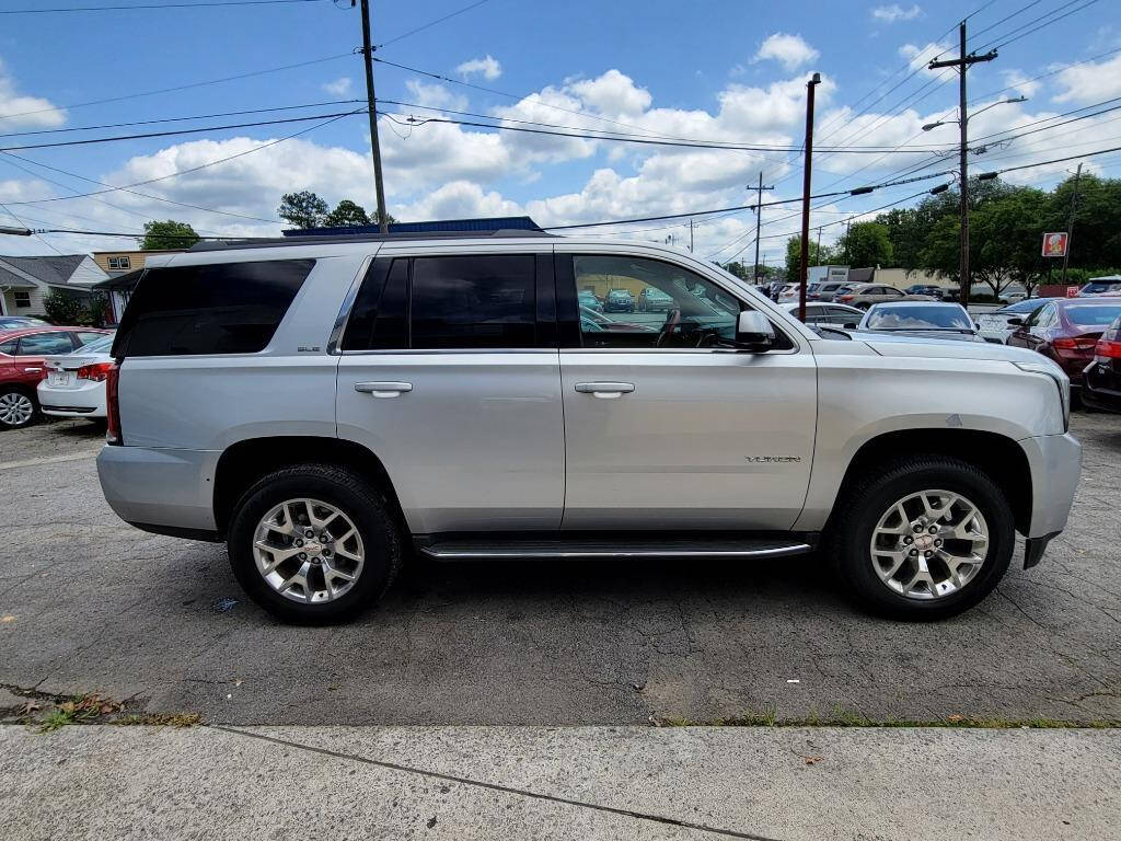 2016 GMC Yukon for sale at DAGO'S AUTO SALES LLC in Dalton, GA