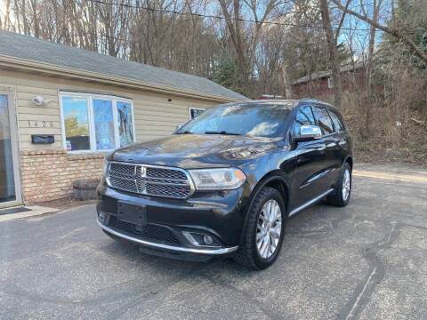 2014 Dodge Durango for sale at Rams Auto Sales LLC in South Saint Paul MN