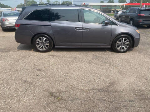 2015 Honda Odyssey for sale at Castle Cars Inc. in Lansing MI