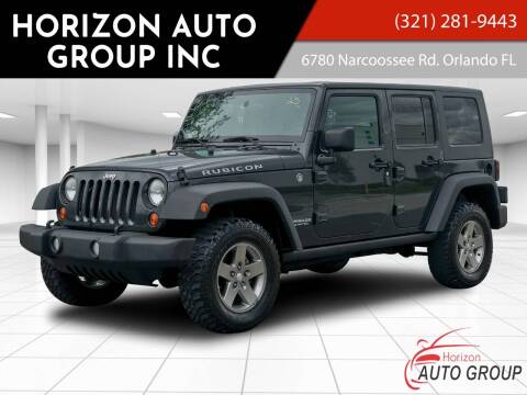 2010 Jeep Wrangler Unlimited for sale at HORIZON AUTO GROUP INC in Orlando FL