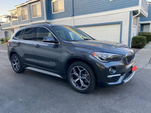 2018 BMW X1 for sale at E and M Auto Sales in Bloomington CA