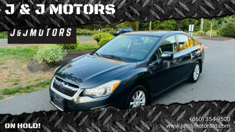 2014 Subaru Impreza for sale at J & J MOTORS in New Milford CT