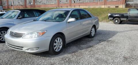 2004 Toyota Camry for sale at SAVORS AUTO CONNECTION LLC in East Liverpool OH
