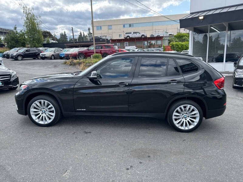 Used 2014 BMW X1 28i with VIN WBAVL1C50EVY19611 for sale in Edmonds, WA