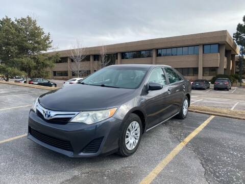 2013 Toyota Camry Hybrid for sale at QUEST MOTORS in Englewood CO