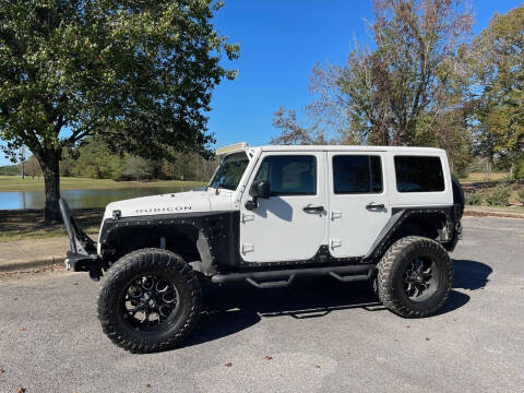 2014 Jeep Wrangler Unlimited for sale at LAMB MOTORS INC in Hamilton AL