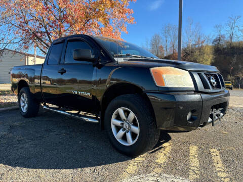 2011 Nissan Titan for sale at Jim's Hometown Auto Sales LLC in Cambridge OH