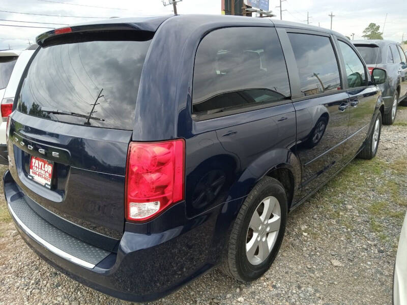 2013 Dodge Grand Caravan for sale at Taylor Trading Co in Beaumont TX