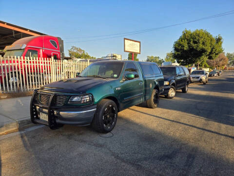 1999 Ford F-150 for sale at E and M Auto Sales in Bloomington CA