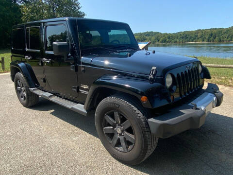 2013 Jeep Wrangler Unlimited for sale at Monroe Auto's, LLC in Parsons TN
