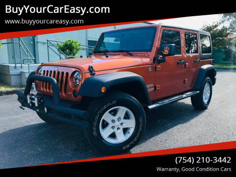 2011 Jeep Wrangler Unlimited for sale at BuyYourCarEasyllc.com in Hollywood FL