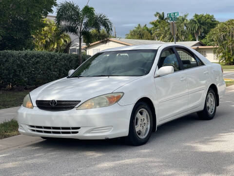 2003 Toyota Camry for sale at L G AUTO SALES in Boynton Beach FL