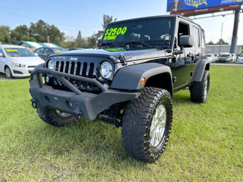 2014 Jeep Wrangler Unlimited for sale at Unique Motor Sport Sales in Kissimmee FL