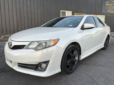 2012 Toyota Camry for sale at BELOW BOOK AUTO SALES in Idaho Falls ID
