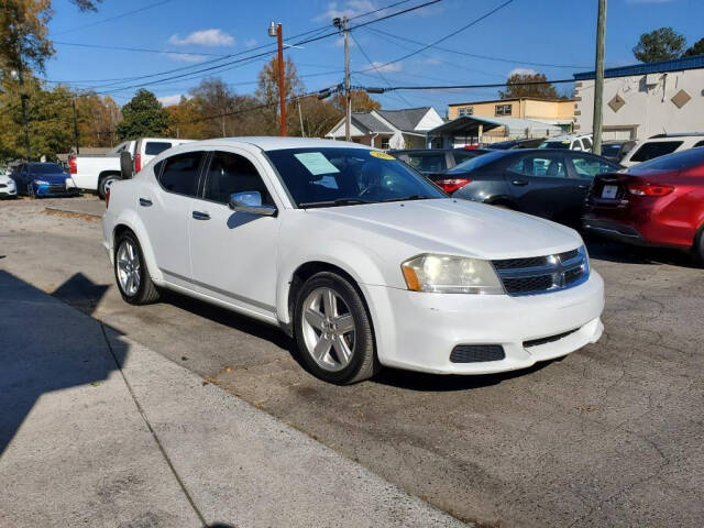 2013 Dodge Avenger for sale at DAGO'S AUTO SALES LLC in Dalton, GA