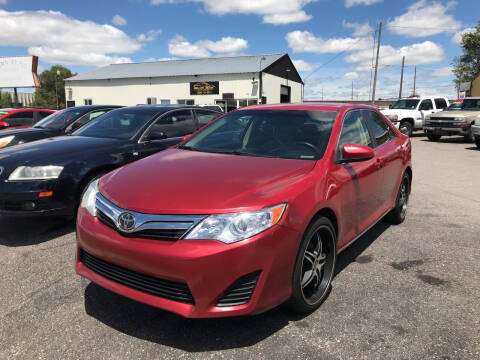 2014 Toyota Camry for sale at BELOW BOOK AUTO SALES in Idaho Falls ID