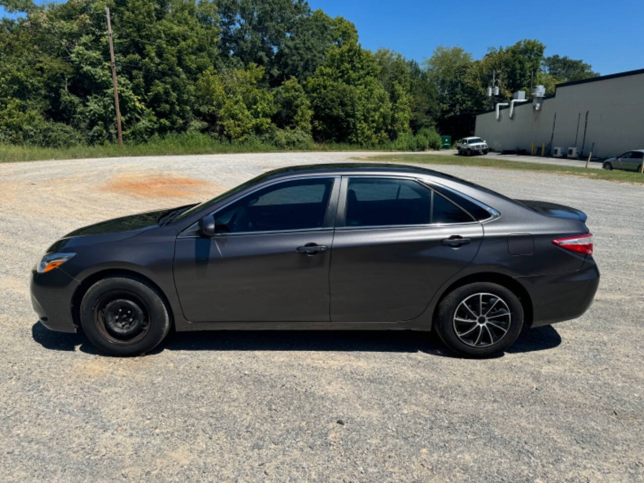 2016 Toyota Camry for sale at Guadalupe Auto Sales, LLC. in Jemison, AL