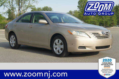 2009 Toyota Camry for sale at Zoom Auto Group in Parsippany NJ