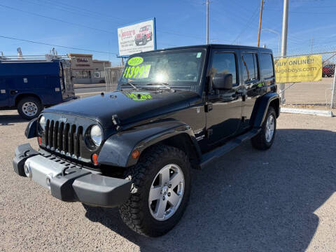 2011 Jeep Wrangler Unlimited for sale at AUGE'S SALES AND SERVICE in Belen NM