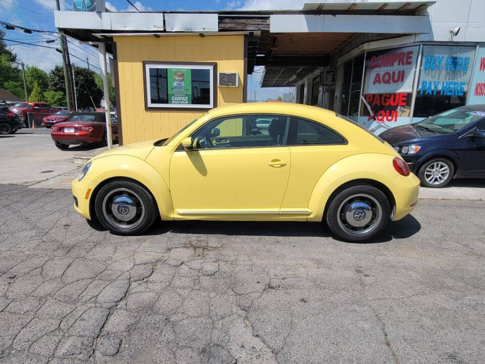 2012 Volkswagen Beetle for sale at DAGO'S AUTO SALES LLC in Dalton, GA