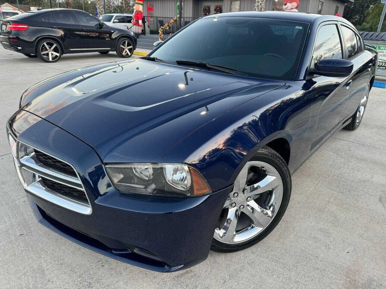 2014 Dodge Charger for sale at DJA Autos Center in Orlando, FL