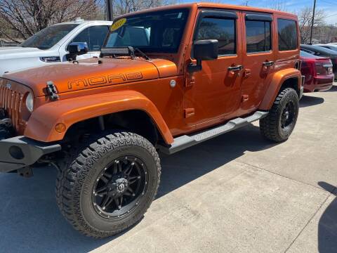 2011 Jeep Wrangler Unlimited for sale at Azteca Auto Sales LLC in Des Moines IA