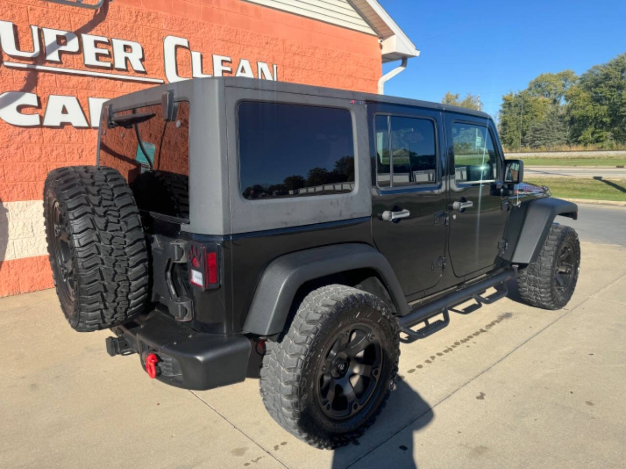 2014 Jeep Wrangler Unlimited for sale at Illinois Auto Wholesalers in Tolono, IL