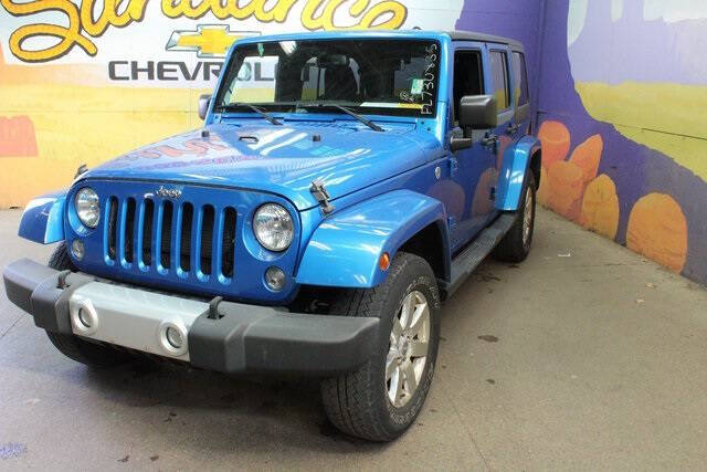 Used 2015 Jeep Wrangler Unlimited Sahara with VIN 1C4BJWEG9FL730835 for sale in Grand Ledge, MI