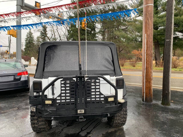 2013 Jeep Wrangler for sale at Chuckie Bizzarro's Fleetwing Auto in Erie, PA