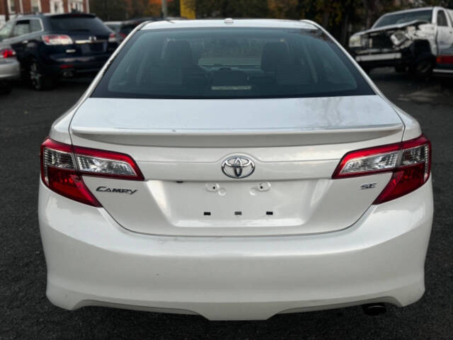 2014 Toyota Camry for sale at Walkem Autos in District Heights, MD