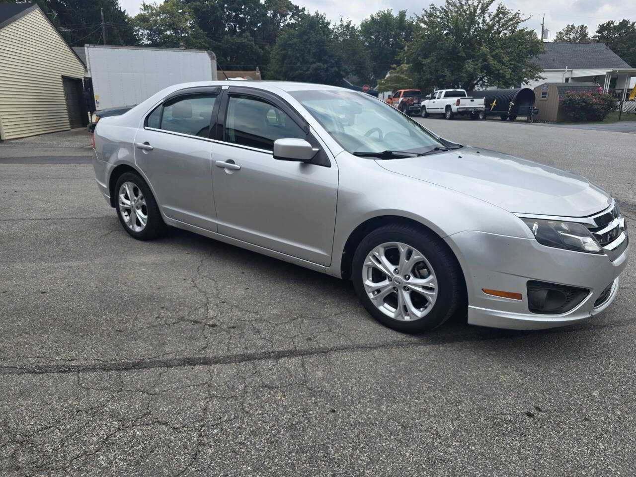 2012 Ford Fusion for sale at QUEENSGATE AUTO SALES in York, PA