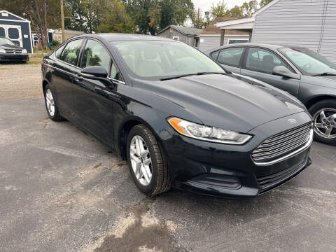 2014 Ford Fusion for sale at HEDGES USED CARS in Carleton MI