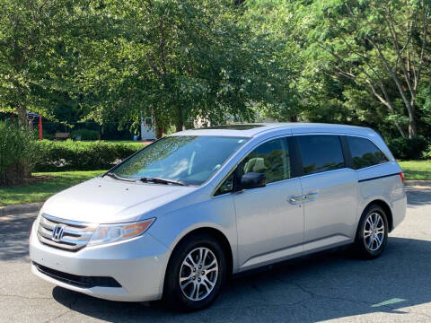 2012 Honda Odyssey for sale at Triangle Motors Inc in Raleigh NC